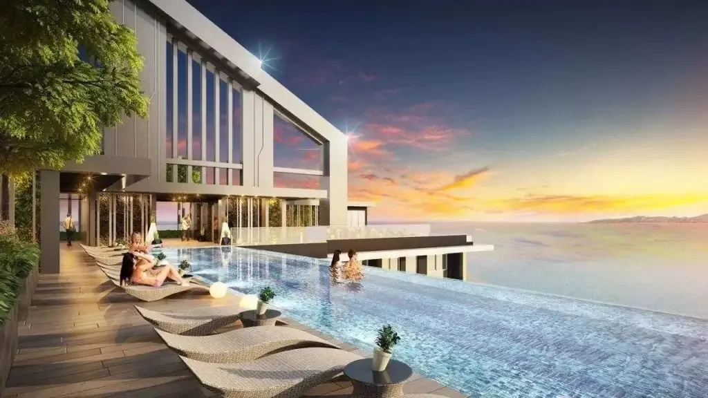 Бассейн у здания ЖК Grand Solaire на закате с видом на море, Джомтьен