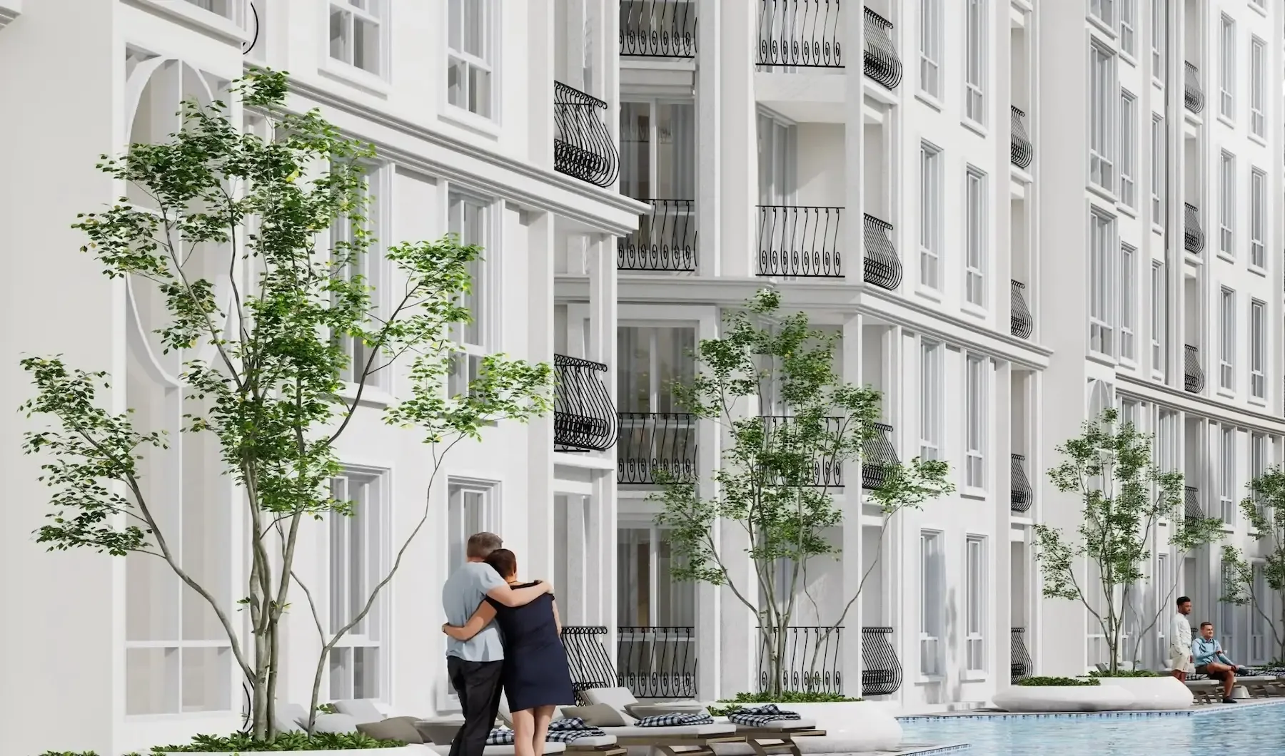 Пара у фасада корпуса ЖК Harmonia City Garden рядом с бассейном на территории