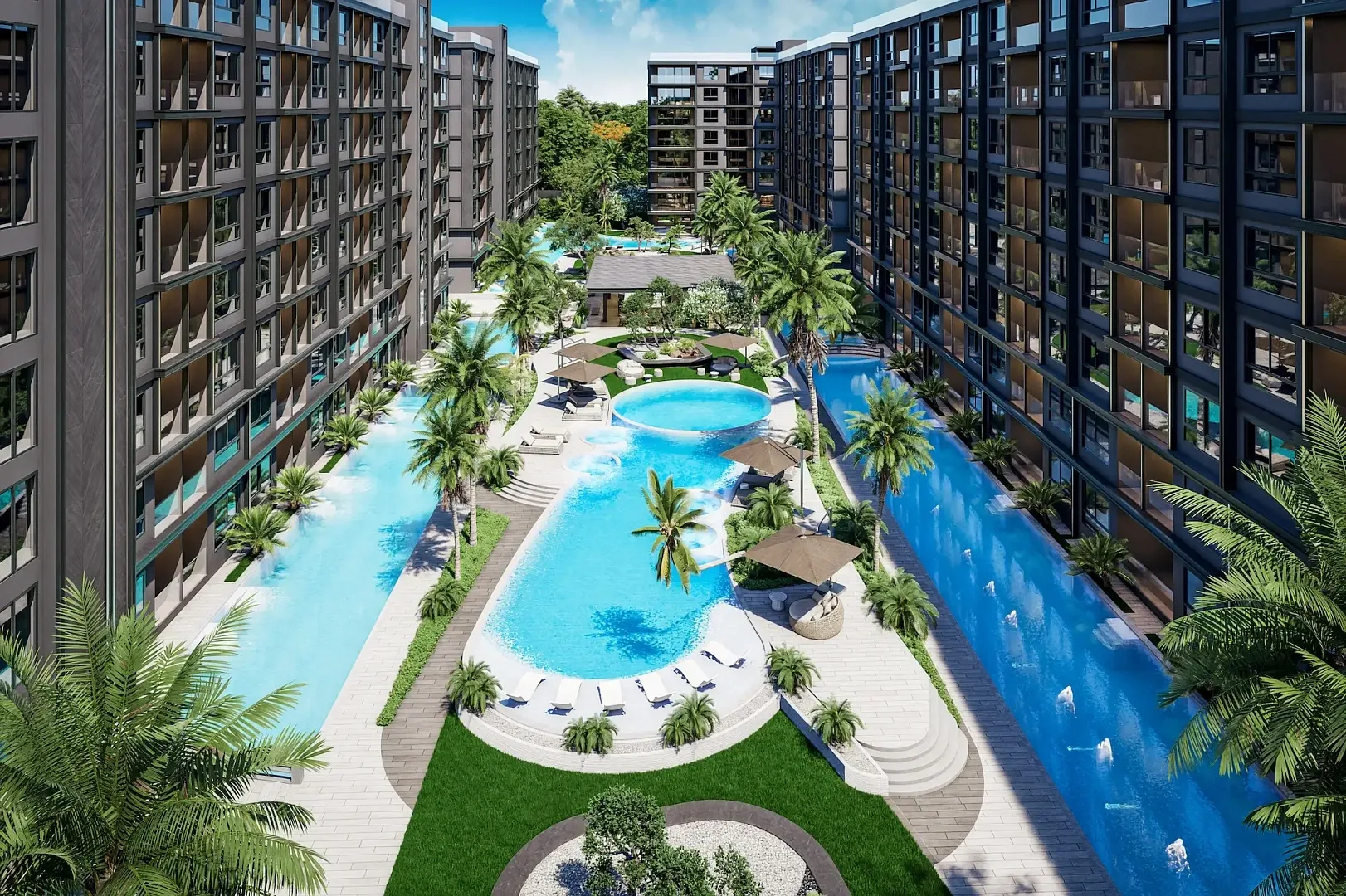 Бассейны с пальмами и зонами отдыха между корпусами ЖК Zenith Pattaya II